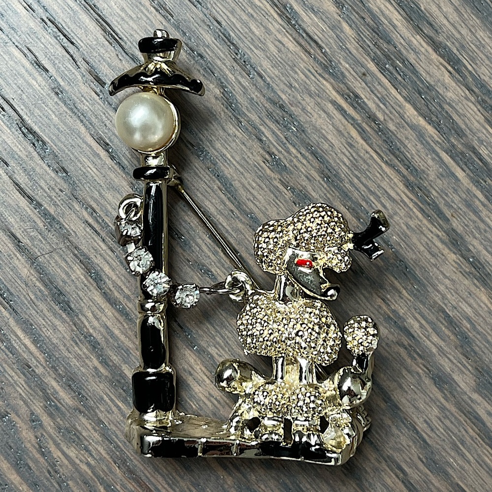 Vintage-style 50s poodle pin with rhinestone accents.